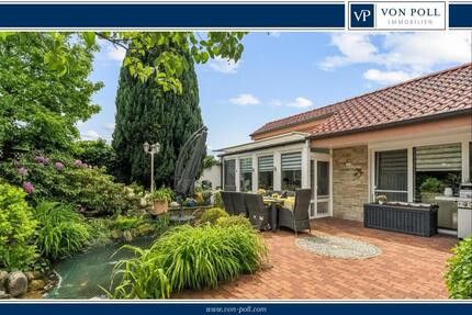 Stilvoller Bungalow mit Wintergarten & Kamin – Wohnen auf einer Ebene in idyllischer Lage - Haus Rheine / Elte Rheine | Angebot:26781763