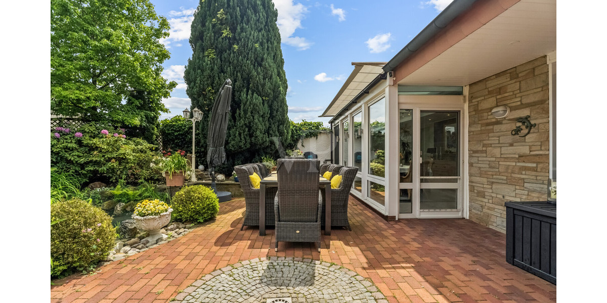 Stilvoller Bungalow mit Wintergarten & Kamin – Wohnen auf einer Ebene in idyllischer Lage - Einfamilienhaus Rheine / Elte Rheine | Angebot:26781763